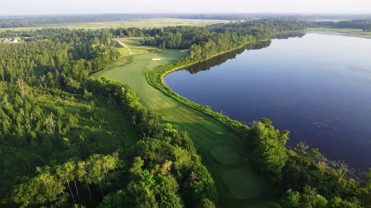 Golf fairway tracing the edge of a Minnesota lake